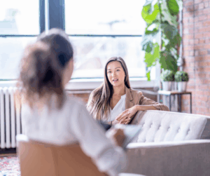 Enneagram coaching presence — coach and client talking during a session about being fully present.