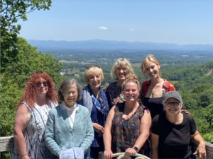 Small group participants at the Enneagram & the Coach Retreat enjoying a mountain overlook in Asheville, North Carolina.
